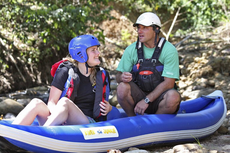 Family rafting on the gentle rapids of Kiulu River