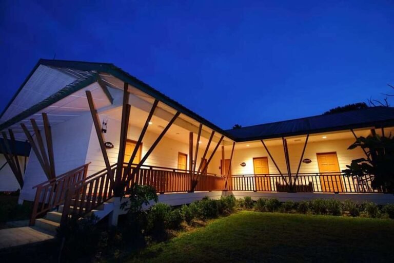 Tanini Sepilok guesthouse exterior lit at dusk, Sepilok, Sabah